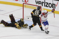 Montreal Canadiens right wing Paul Byron, right, celebrates after scoring on Vegas Golden Knights goaltender Marc-Andre Fleury (29) during the second period in Game 2 of an NHL hockey Stanley Cup semifinal playoff series, Wednesday, June 16, 2021, in Las Vegas. (AP Photo/David Becker)