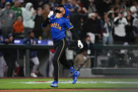 Seattle Mariners' J.P. Crawford jogs home after hitting a solo home run against the Boston Red Sox during the sixth inning of a baseball game Friday, March 29, 2024, in Seattle. (AP Photo/Lindsey Wasson)