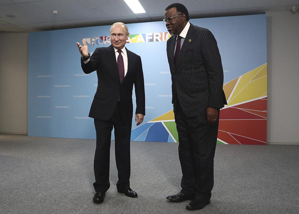 Russian President Vladimir Putin, left, welcomes Namibia's President Hage Geingob prior to their talks on the sideline of Russia-Africa summit in the Black Sea resort of Sochi, Russia, Wednesday, Oct. 23, 2019. (Sergei Fadeyechev, TASS News Agency Pool Photo via AP)