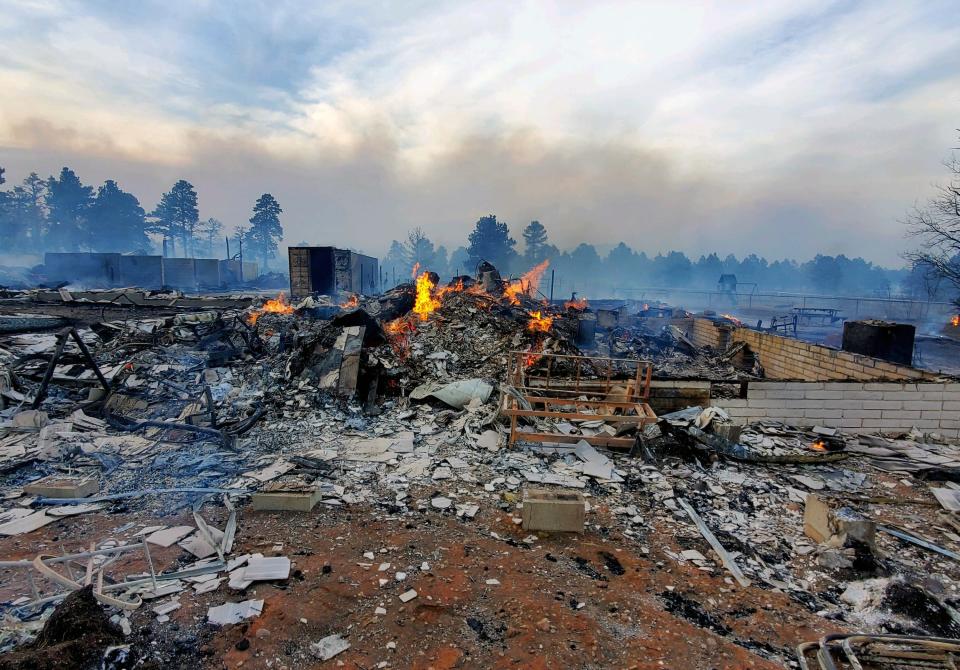 This photo from April 20, 2022, provided by Bill Wells shows his home on the outskirts of Flagstaff destroyed by a wildfire on April 19, 2022.
