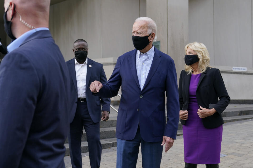 Democratic presidential candidate and former Vice President Joe Biden speaks with reporters as he and his wife Jill Biden depart after voting early in Delaware's state primary election at the New Castle County Board of Elections office in Wilmington, Del., Monday, Sept. 14, 2020. (AP Photo/Patrick Semansky)