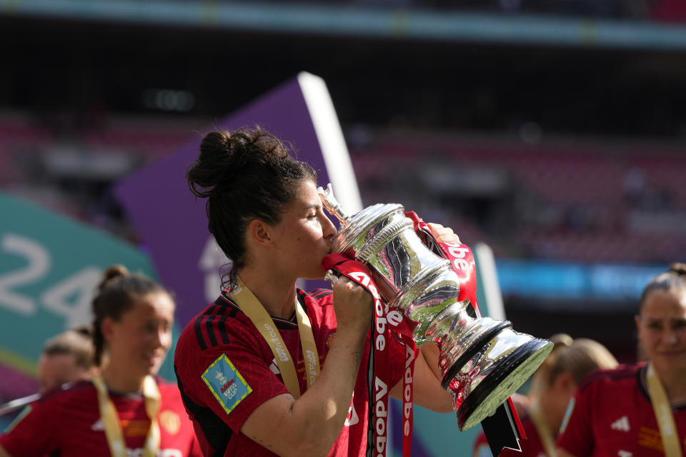 Manchester United's Lucia Garcia kisses the trophy after winning the Women's FA Cup final soccer match between Manchester United and Tottenham Hotspur at Wembley Stadium in London, Sunday, May 12, 2024. Manchester United won 4-0. (AP Photo/Kirsty Wigglesworth)