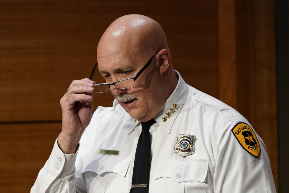 FILE - In this Monday, Sept. 21, 2020, file photo, Salt Lake City Chief of Police Mike Brown speaks during a news conference in Salt Lake City. Salt Lake City's police dog apprehension program will remain suspended indefinitely, the police chief announced Friday, Sepr. 25, 2020, after an officer ordered a dog to attack a Black man who had put his hands in the air. (AP Photo/Rick Bowmer, File)