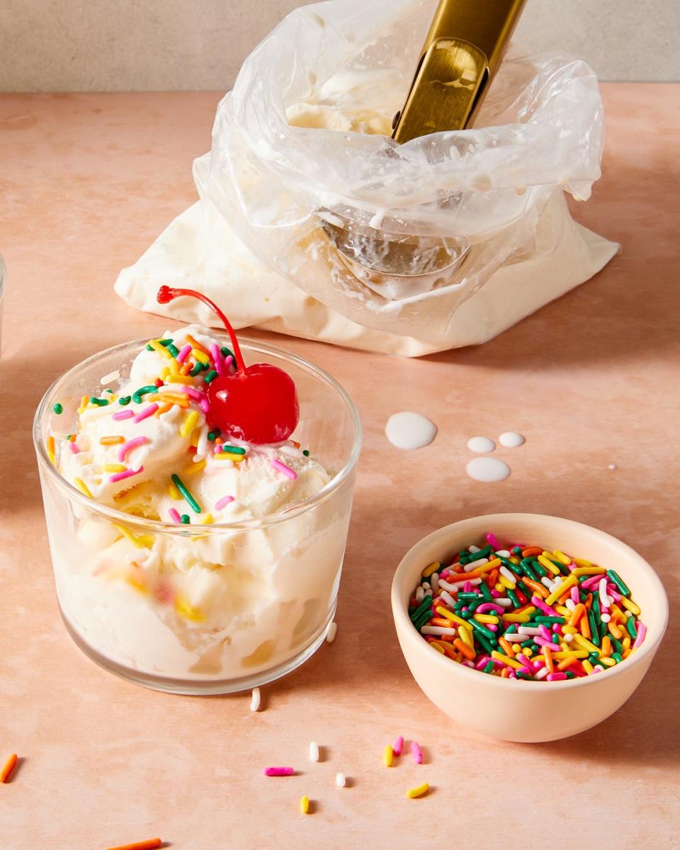 ice cream in a bag with cherries, sprinkles, and toppings