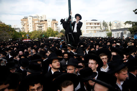 Ultra-Orthodox Jews gather during the funeral ceremony of prominent spiritual leader Rabbi Aharon Yehuda Leib Steinman, who died on Tuesday at the age of 104, in Bnei Brak near Tel Aviv, Israel December 12, 2017. REUTERS/Baz Ratner