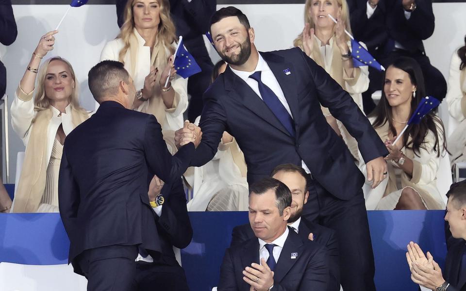 Jon Rahm and Sergio Garcia shake hands - SHUTTERSTOCK