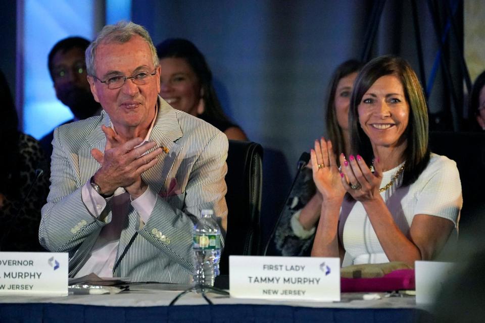 PHOTO: New Jersey Gov. Phil Murphy, left, and first lady Tammy Murphy attend the National Governors Association summer meeting, July 15, 2022, in Portland, Maine.  (Robert F. Bukaty/AP)