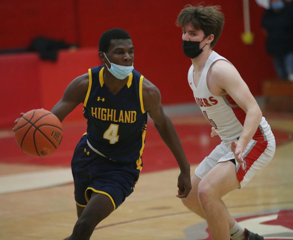 Highland's Osei Adoma is covered by Red Hook's Carter Donohue during Friday's game on February 18, 2022. 