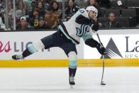 Seattle Kraken center Matty Beniers shoots the puck against the San Jose Sharks during the second period of an NHL hockey game in San Jose, Calif., Monday, April 1, 2024. (AP Photo/Jeff Chiu)