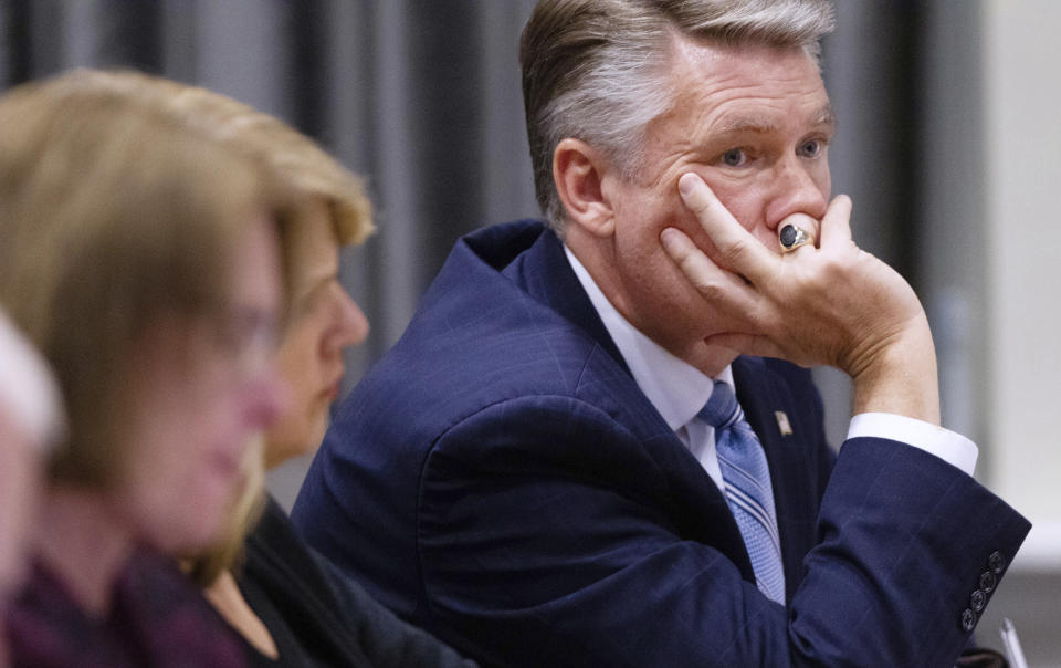 Mark Harris, Republican candidate in North Carolina's 9th Congressional race, listens to testimony during the third day of a public evidentiary hearing on the 9th Congressional District voting irregularities investigation Wednesday, Feb. 20, 2019, at the North Carolina State Bar in Raleigh, N.C. (Travis Long/The News & Observer via AP, Pool)