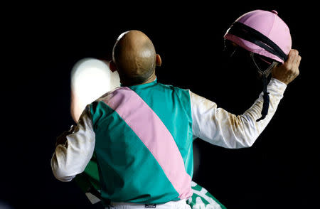 Horse Racing - Dubai World Cup - Meydan Racecourse, Dubai - 25/3/17 - Mike Smith riding Arrogate celebrates winning the ninth and final race. REUTERS/Ahmed Jadallah