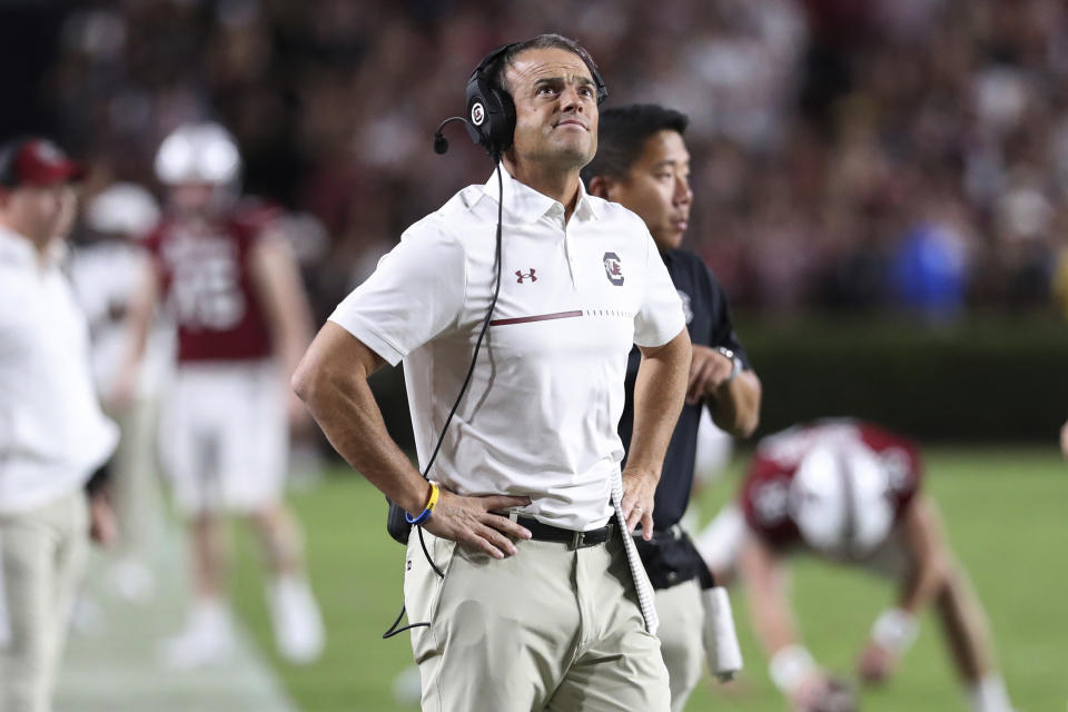 South Carolina coach Shane Beamer checks the scoreboard during the first half of the team's NCAA college football game against Charlotte on Saturday, Sept. 24, 2022, in Columbia, S.C. (AP Photo/Artie Walker Jr.)