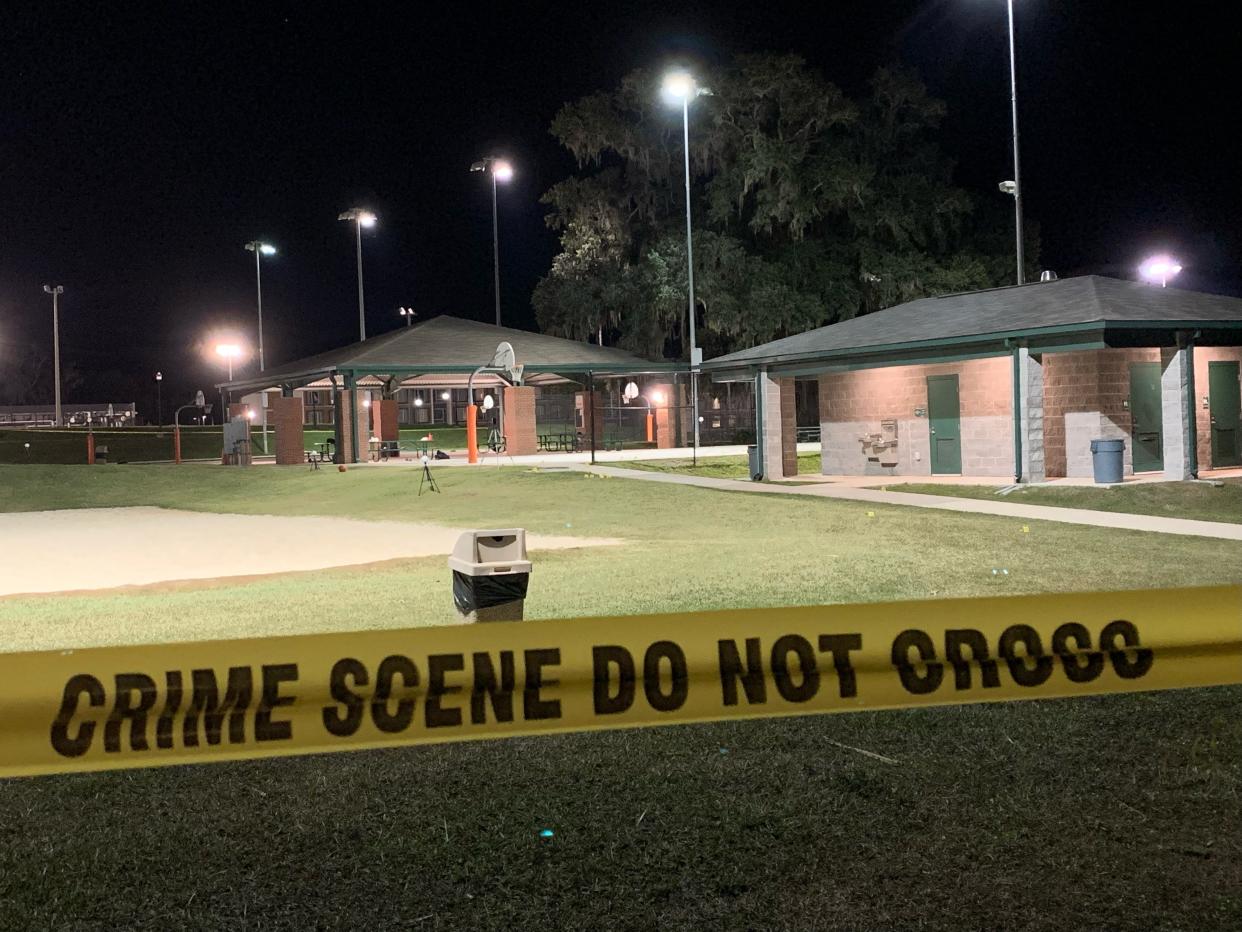 Yellow crime scene tape marks off the area where a shooting took place on Nov. 27 at a basketball court on Florida A&M University's campus.