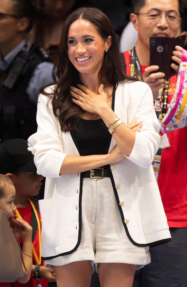 Meghan Markle Compared To Princess Diana As She Wears White Cardigan And  Shorts For Invictus Games With Prince Harry