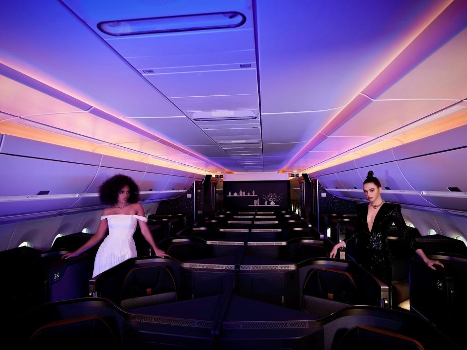 The blue, pink, and orange ambient lighting onboard Starlux