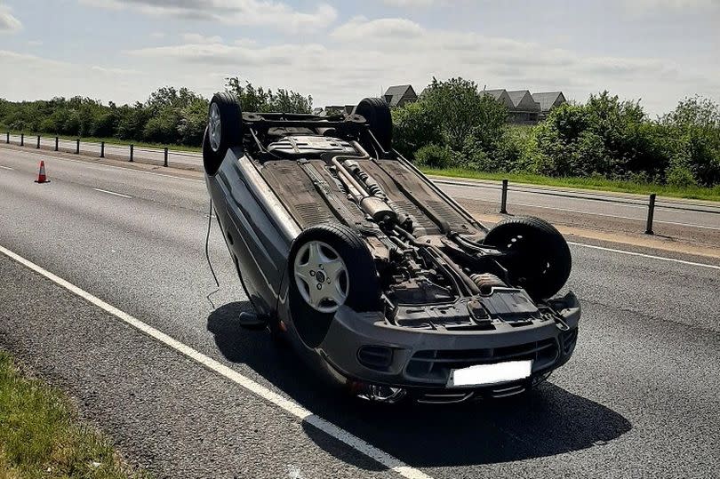 A driver 'frightened by a spider' flipped their car on a busy dual-carriageway