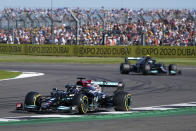 Mercedes driver Lewis Hamilton of Britain steers his car followed by Mercedes driver Valtteri Bottas of Finland during the Sprint Qualifying of the British Formula One Grand Prix, at the Silverstone circuit, in Silverstone, England, Saturday, July 17, 2021. The British Formula One Grand Prix will be held on Sunday. (AP Photo/Jon Super)