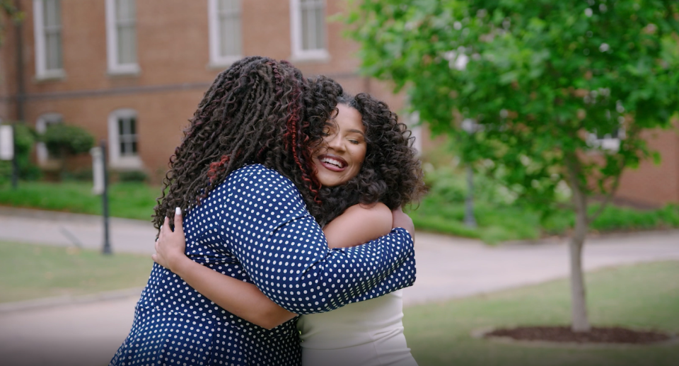 Alyssa Cabezas, a 2022 graduate of Spelman College from Vicksburg, Mississippi, hugs her mentor Charese Mignon Morrisette-Eason, of Detroit, a project manager with the Ford Motor Co. global supply chain innovation team. They are seen here in Atlanta in May 2022.
