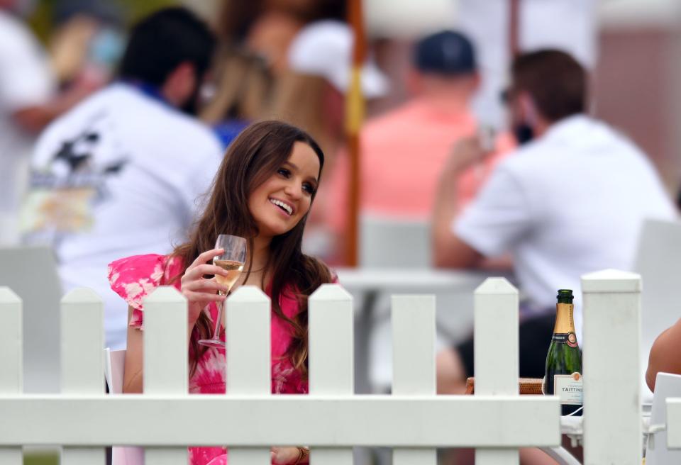 A golf fan enjoys the view during the 2021 Honda Classic at PGA National Resort and Spa in Palm Beach Gardens.