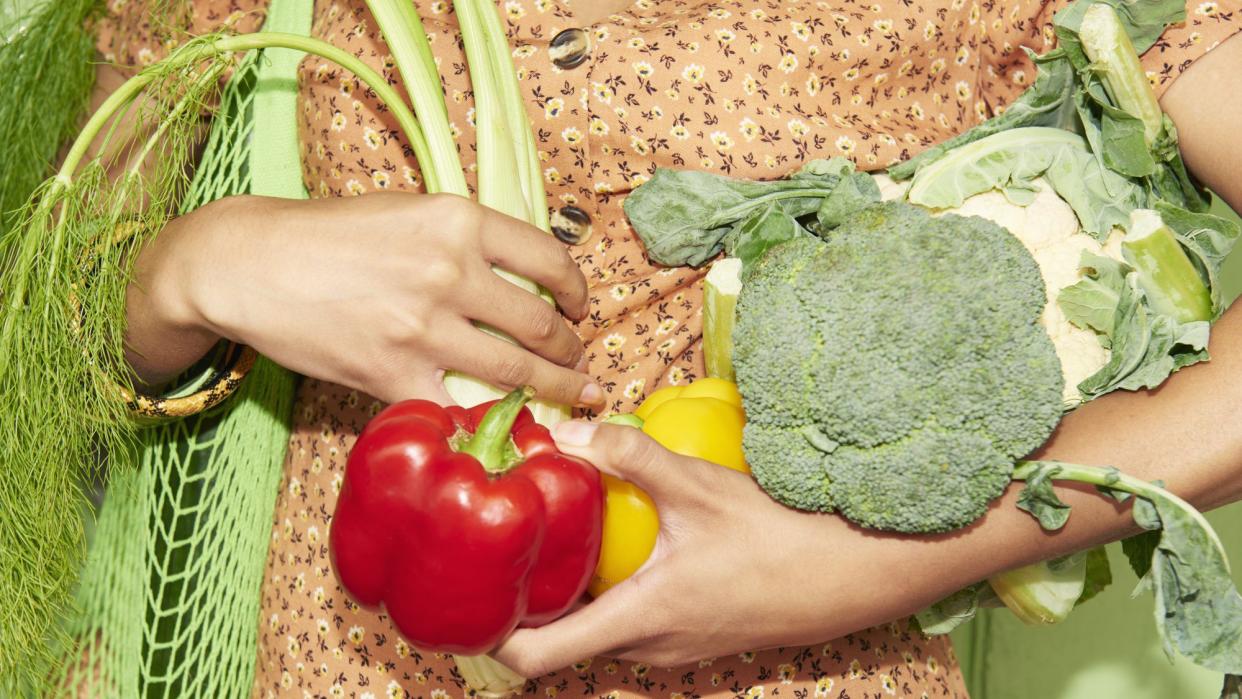 8 Situations When You Should Consult a Nutritionist That May Surprise You , Close up of woman holding vegetables