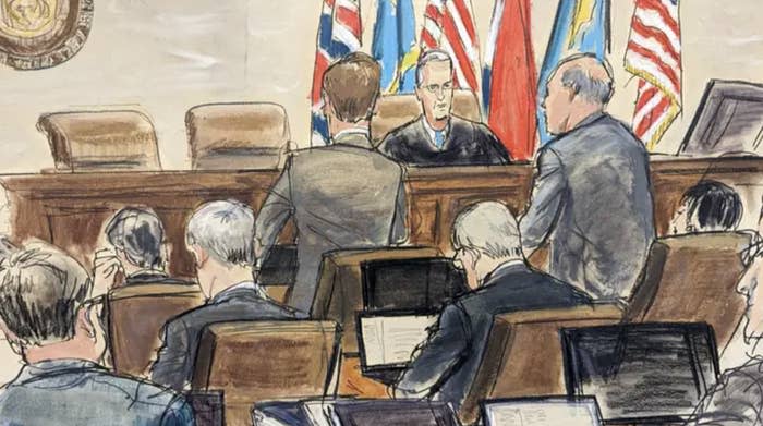 A courtroom sketch shows Dominion Voting Systems attorney Justin Nelson (standing left) and Fox News attorney Daniel Webb speaking to Judge Eric Davis in Delaware Superior Court in Wilmington, on April 18, 2023.