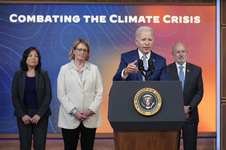 President Joe Biden speaks during an event to announce new measures aimed at helping communities deal with extreme weather, in the South Court Auditorium on the White House Campus, Thursday, July 27, 2023, in Washington. From left, Julie Su, Acting Labor Secretary, Federal Emergency Management Agency administrator Deanne Criswell, Biden and Rick Spinrad, Administrator of the National Oceanic and Atmospheric Administration. (AP Photo/Evan Vucci)