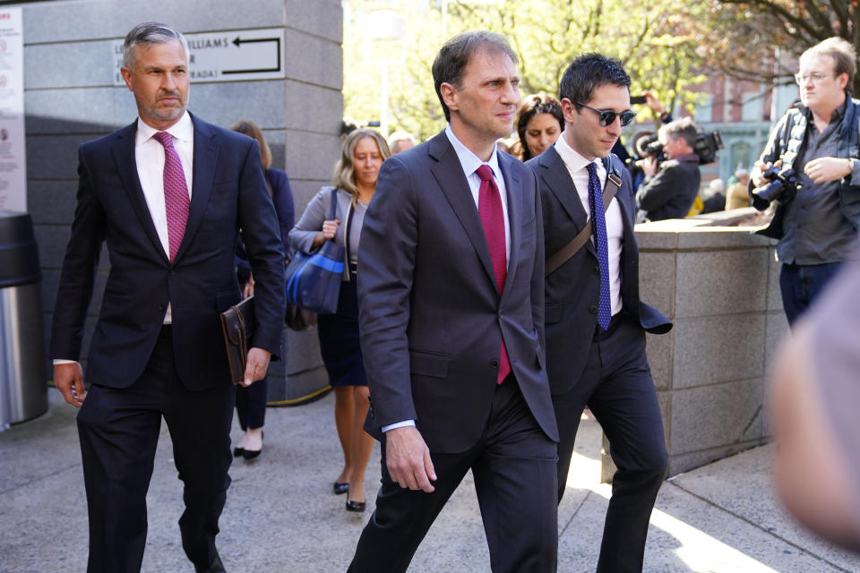 Attorney Justin Nelson, center, representing Dominion Voting Systems, walks from a news conference outside New Castle County Courthouse in Wilmington, Del., after the defamation lawsuit by Dominion Voting Systems against Fox News was settled just as the jury trial was set to begin, Tuesday, April 18, 2023. (AP Photo/Matt Rourke)