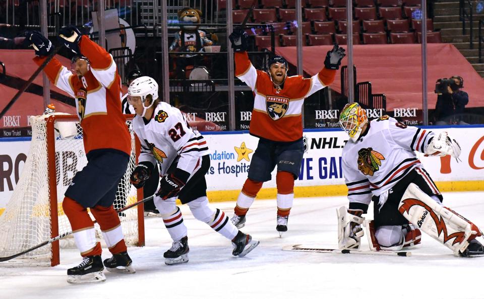 Florida Panthers right wing Patric Hornqvist, left, celebrates a goal with teammate Jonathan Huberdeau, center, against Chicago on Sunday, Jan. 17.