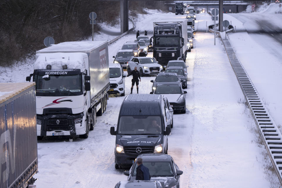 CORRECTS COUNTRY TO DENMARK AND SOURCE TO RITZAU SCANPIX - A number of trucks and cars are stuck on the E45 motorway near Randers in Jutland, Denmark, Thursday, Jan. 4, 2024. Temperatures have fallen below minus 40 degrees Celsius in the Nordic region for a second day in a row, with the coldest January temperature recorded in Swedish Lapland in 25 years. The weather -– cold with snow and gale-force winds -- has disrupted transportation throughout the Nordic region. In stark contrast, mild temperatures, strong winds and heavy rain further south in western Europe caused flooding and at least one death. (Bo Amstrup/Ritzau Scanpix via AP)