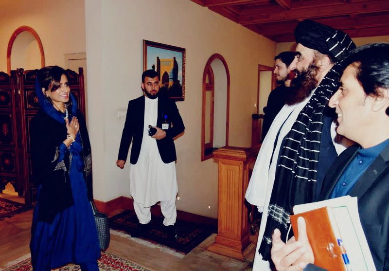 Pakistan's Minister of State Hina Rabbani Khar, welcomed by the acting Afghan foreign Minister Amir Khan Muttaqi, upon her arrival in Kabul