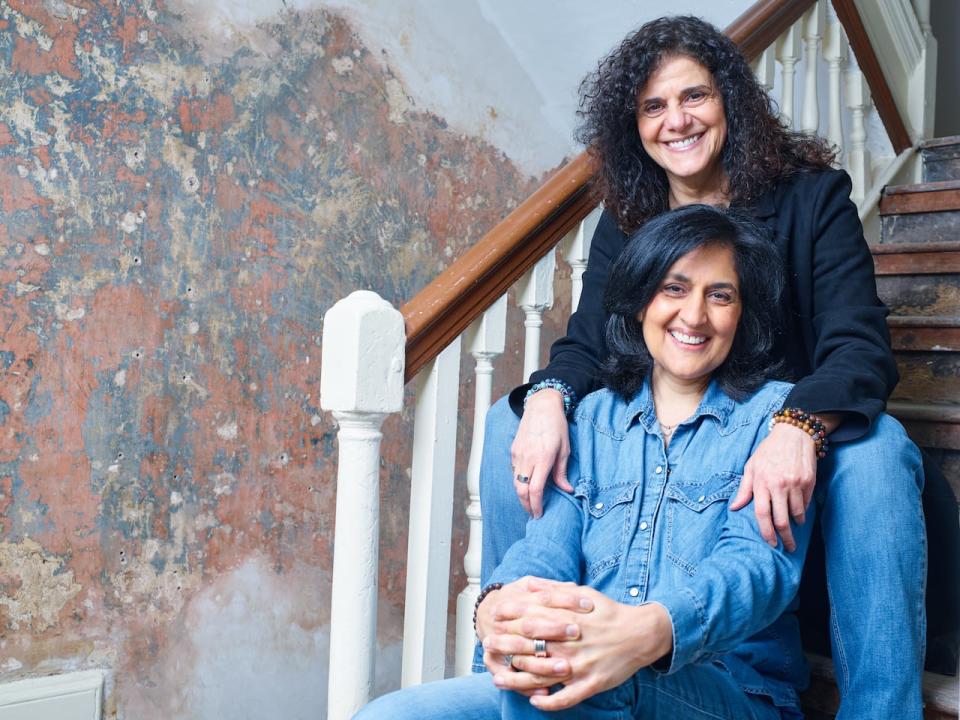 Shamim Sarif, front, is the writer-director of the feature film Polarized, inspired in part by her own relationship of 27 years with her wife and creative partner, Hanan Kattan, back, who produced the film.