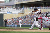 Minnesota Twins left fielder Alex Kirilloff hits a two-run double against the Cleveland Guardians in the fourth inning of a baseball game Tuesday, June 21, 2022, in Minneapolis. (AP Photo/Andy Clayton-King)