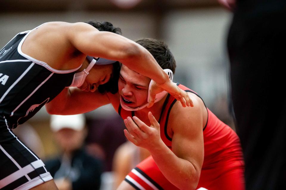 Holland's Joel Morin and West Ottawa's Anthony Jaramillo wrestle Saturday, Jan. 14, 2023, at Holland High School.