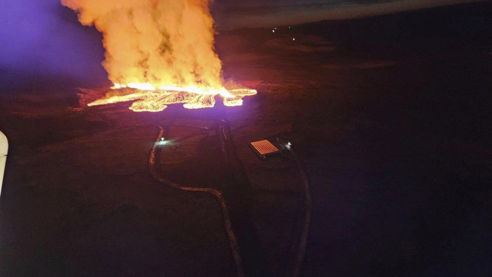 In this photo provided by Civil Protection taken from the Coast Guard's helicopter, a view of lava as the volcano erupts near Grindavík, Iceland, Sunday, Jan. 14. 2024. A volcano has erupted in southwestern Iceland, sending semi-molten rock spewing toward a nearby settlement for the second time in less than a month. Iceland's Icelandic Meteorological Office says the eruption Sunday came after a swarm of earthquakes near the town of Grindavik. (Icelandic Civil Protection via AP)