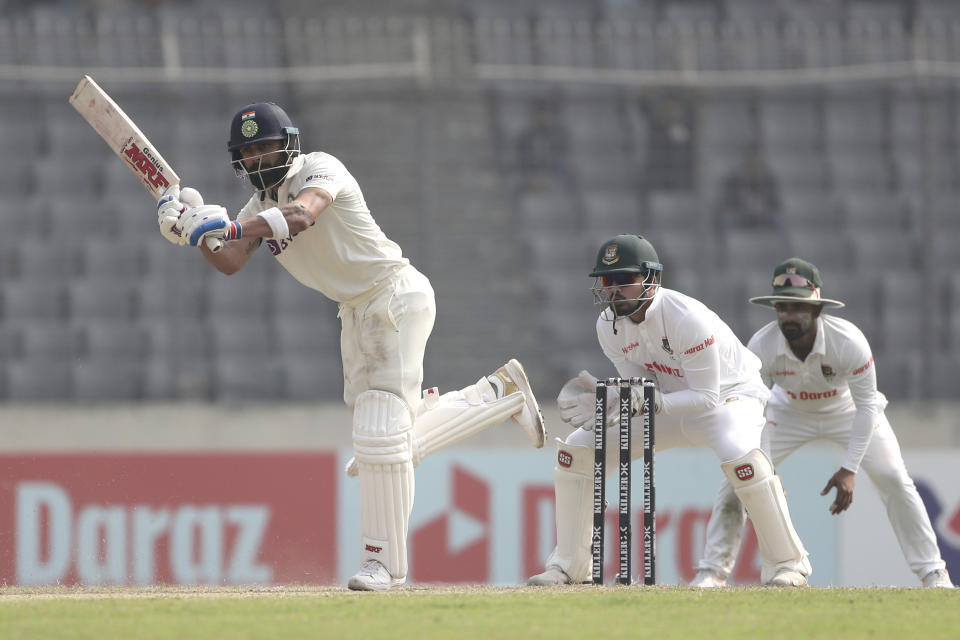 India's Virat Kohli, left, bats during the second day of the second cricket test match between Bangladesh and India, in Dhaka, Bangladesh, Friday, Dec. 23, 2022. (AP Photo/Surjeet Yadav)