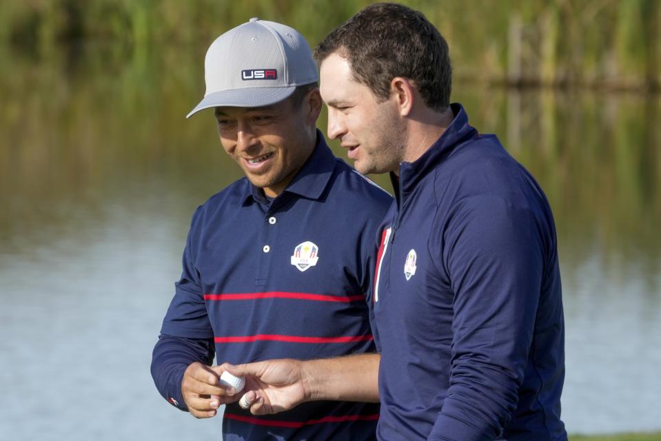 Team USA's Scottie Scheffler talks to Team USA's Patrick Cantlay during a foursome match the Ryder Cup at the Whistling Straits Golf Course Friday, Sept. 24, 2021, in Sheboygan, Wis. (AP Photo/Charlie Neibergall)