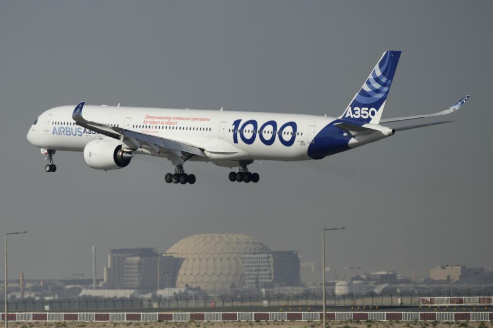 With the Expo City dome in the background, an Airbus A350 prepares for landing during second day of the Dubai Air Show, United Arab Emirates, Tuesday, Nov. 14, 2023. (AP Photo/Kamran Jebreili)