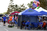 Florida and Georgia fans tailgate before their annual NCAA college football game, Saturday, Oct. 28, 2023, in Jacksonville, Fla. (AP Photo/John Raoux)