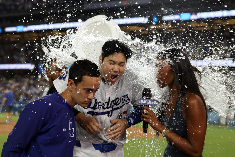 LOS ANGELES, CALIFORNIA - AUGUST 23: Shohei Ohtani #17 of the Los Angeles Dodgers is doused with Gatorade after hitting a walk-off grand slam homerun, his 40th homerun of the season, against the Tampa Bay Rays at Dodger Stadium on August 23, 2024 in Los Angeles, California. (Photo by Katelyn Mulcahy/Getty Images)