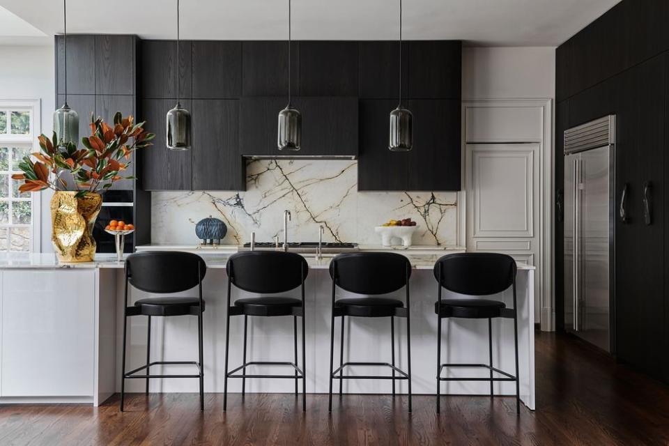 a kitchen with black cabinets