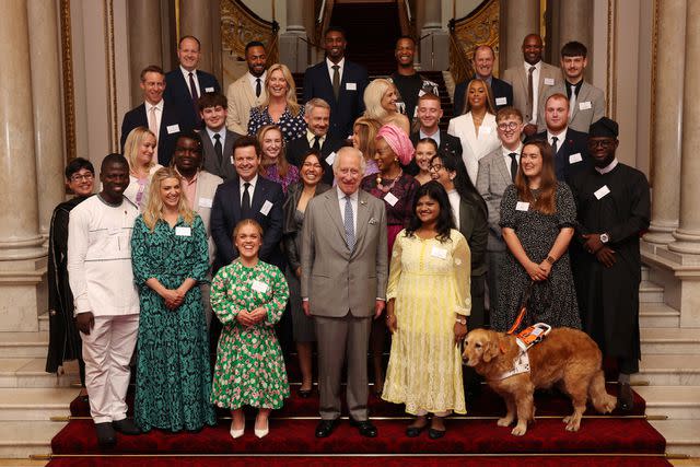 <p>Chris Jackson/Getty</p> King Charles (center) poses with winners of the Prince's Trust Awards at Buckingham Palace on May 22, 2024.