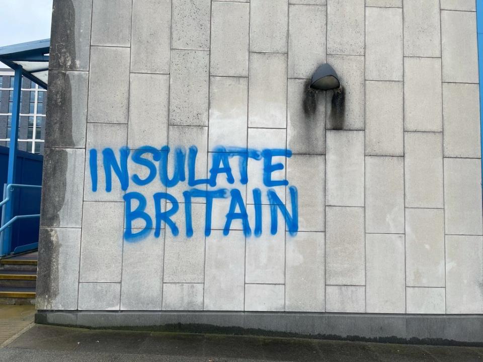 The words ‘Insulate Britain’ spray-painted on Crawley Magistrates’ court(Luke O’Reilly/PA) (PA Wire)