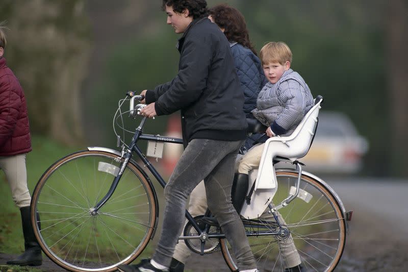 <p> Not being happy at all about being in the kiddie seat on this bike. </p>