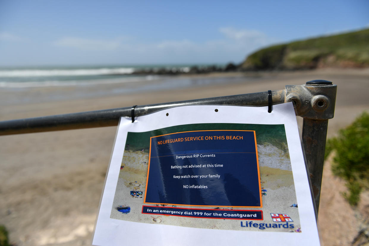 CHALLABOROUGH, ENGLAND - MAY 23: A warning notice is displayed informing visitors that there is no RNLI Lifeguards on duty on May 23, 2020 in Challaborough, England. The British government has started easing the lockdown it imposed two months ago to curb the spread of Covid-19, abandoning its 'stay at home' slogan in favour of a message to 'be alert', but UK countries have varied in their approaches to relaxing quarantine measures. (Photo by Dan Mullan/Getty Images)