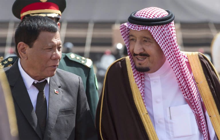 A handout picture provided by the Saudi royal palace shows Saudi King Salman (R) receiving Philippine President Rodrigo Duterte (L) in Riyadh on April 11, 2017 at the start of a Gulf tour