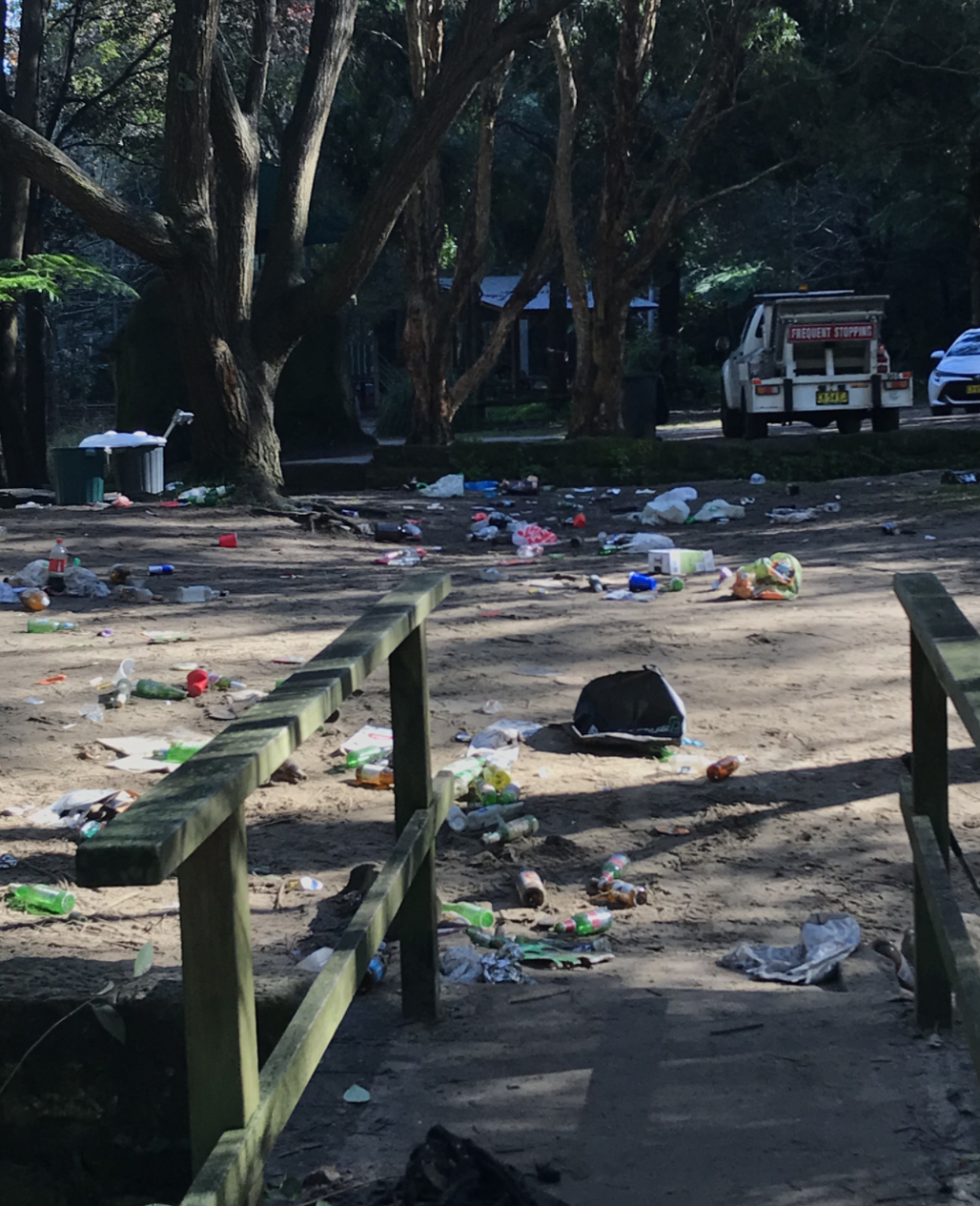 Photo shows mess left in Cooper Park, Sydney, after a party on Saturday night. 