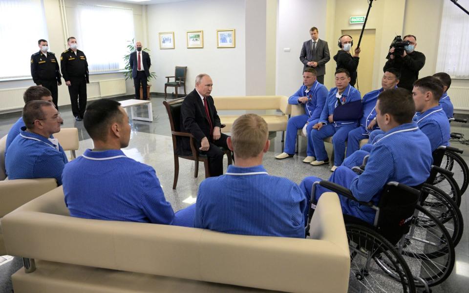 Russia's President Vladimir Putin meets with Russian service members who were injured during the Russia-Ukraine conflict and are currently undergoing treatment at a military hospital, following an awarding ceremony in Moscow - SPUTNIK/via REUTERS