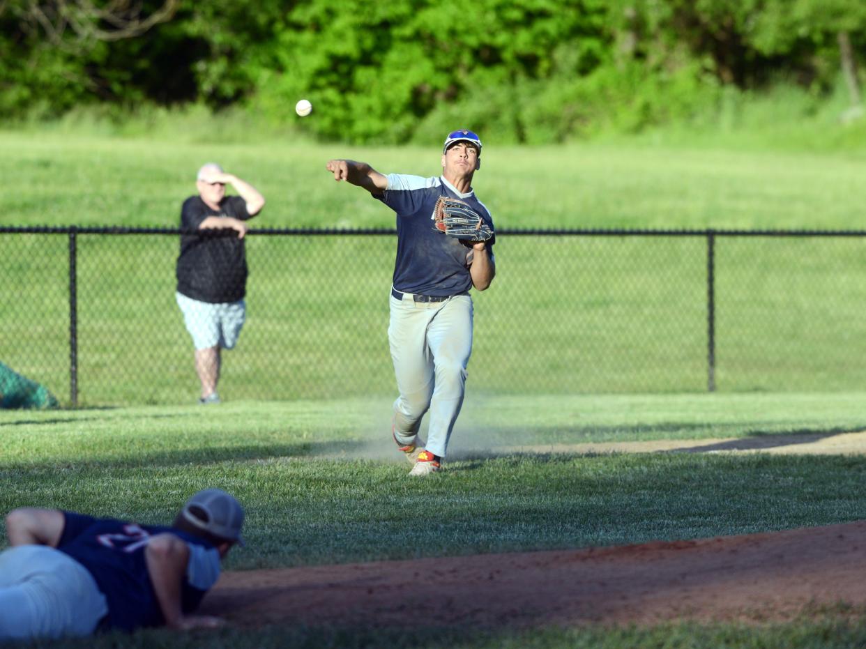 Wade Pauley, of Morgan, fires a throw to first base during a Division II sectional final against John Glenn. Pauley was named the MVL Small School Division player of the year.