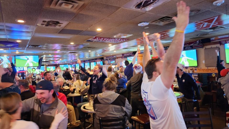 Fans celebrate after Timothy Weah finds the back of the net to open scoring in a opening round match between the United States and Wales inside the Gateway Casino and Lounge in Sioux Falls on Nov. 21, 2022.