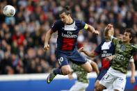 Paris St Germain's Zlatan Ibrahimovic shoots and scores a goal for the team during their French Ligue 1 soccer match against Bastia at the Parc des Princes Stadium in Paris October 19, 2013. REUTERS/Benoit Tessier (FRANCE - Tags: SPORT SOCCER TPX IMAGES OF THE DAY)